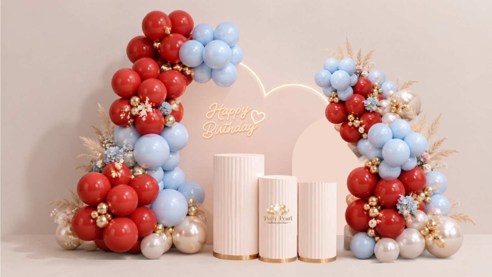 Full balloon garland across three arch backdrops with three pedestals and neon sign