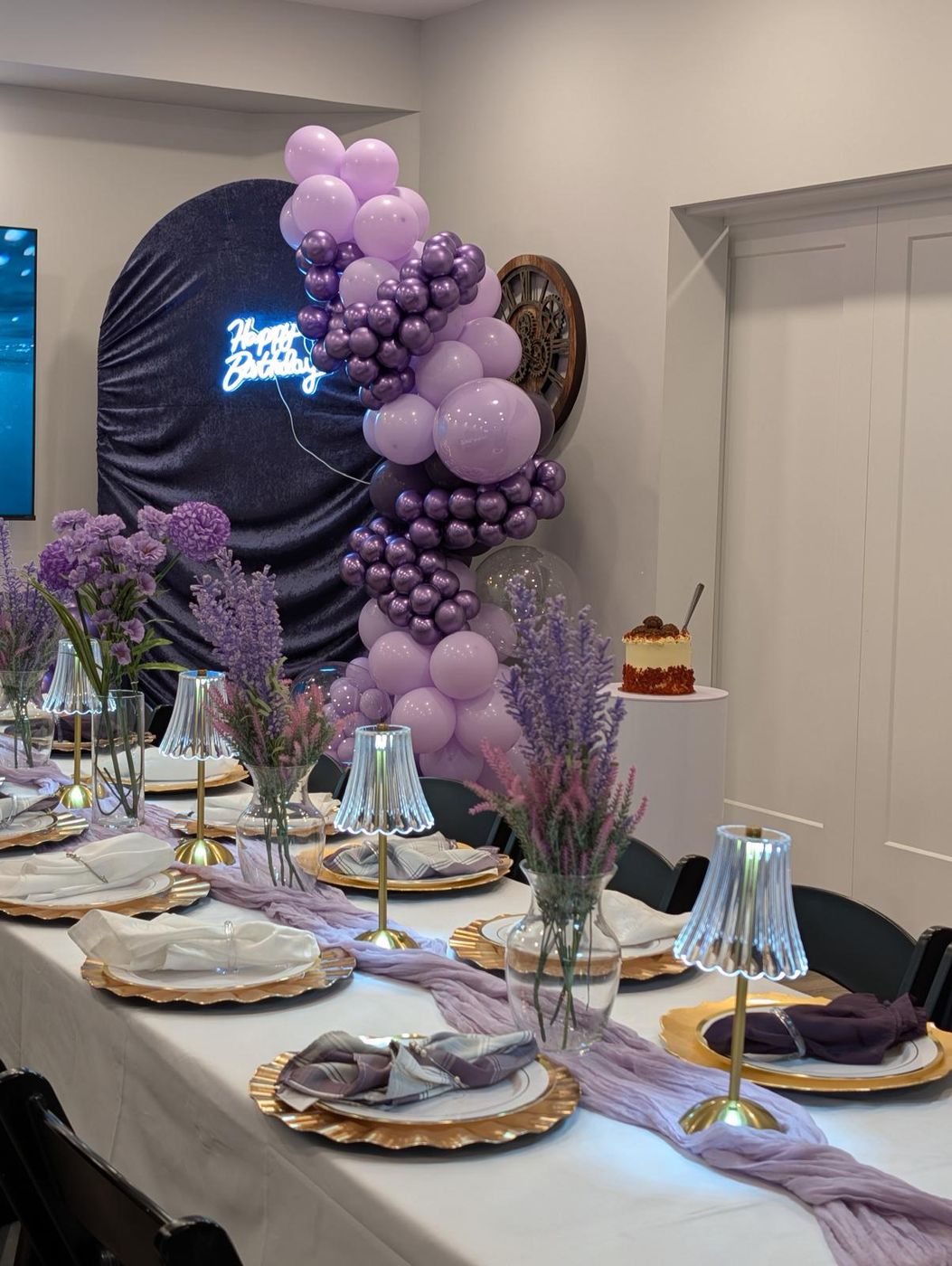 Lavender table styling with lamps and floral centerpieces